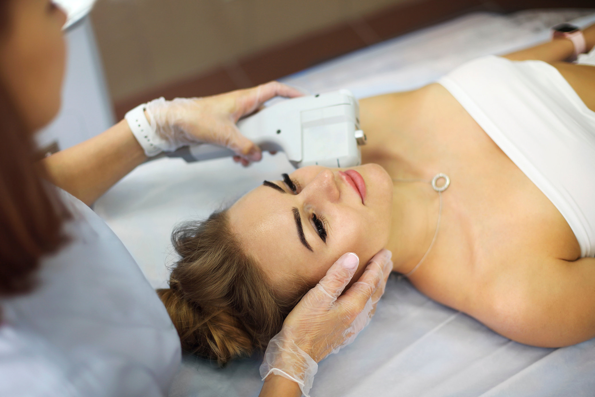 Beautiful Elegant Caucasian Woman Lying on Medicine Chair While